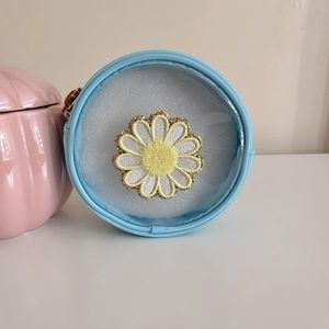 Stoney clover lane x target round blue pouch with a daisy patch